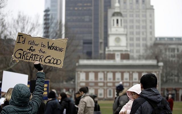 Furloughed federal worker Meghan Powell, holding sign on left, demonstrates with others against the partial government shutdown in view of Independence Hall in Philadelphia, Tuesday, Jan. 8, 2019. (AP Photo/Matt Rourke) Furloughed federal worker Meghan Powell, holding sign on left, demonstrates with others against the partial government shutdown in view of Independence Hall in Philadelphia, Tuesday, Jan. 8, 2019. (AP Photo/Matt Rourke)