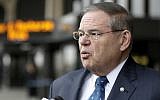 US Senator Bob Menendez is interviewed outside Newark Liberty International Airport after attending a news conference to address the partial government shutdown, which is keeping airport employees working without pay, on January 8, 2019, in Newark, New Jersey. (AP Photo/Julio Cortez)