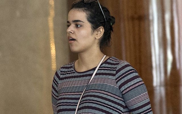 Rahaf Mohammed Alqunun walks in Bangkok, Thailand, Friday, Jan. 11, 2019. Alqunun, the 18-year old Saudi woman who fled her family to seek asylum, remains in Thailand under the care of the UN refugee agency as she awaits a decision by a third country to accept her as a refugee. (AP Photo/Sakchai Lalit) Rahaf Mohammed Alqunun walks in Bangkok, Thailand, Friday, Jan. 11, 2019. Alqunun, the 18-year old Saudi woman who fled her family to seek asylum, remains in Thailand under the care of the UN refugee agency as she awaits a decision by a third country to accept her as a refugee. (AP Photo/Sakchai Lalit)