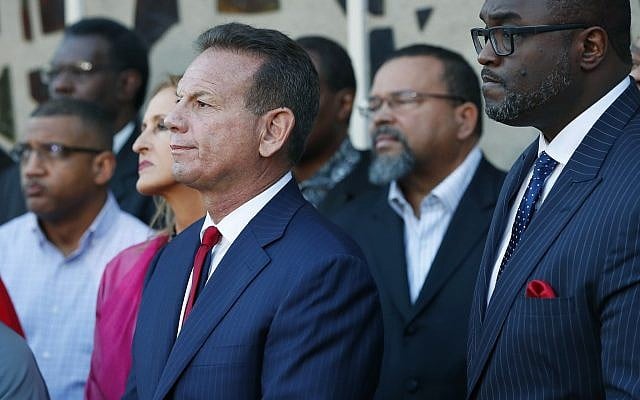 Suspended Broward County Sheriff Scott Israel, center, at a news conference after new Florida Gov. Ron DeSantis suspended Israel on January 11, 2019, in Fort Lauderdale, Florida. (AP Photo/Wilfredo Lee)