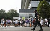 Family and friends who have lost loved ones to OxyContin and opioid overdoses protest outside Purdue Pharma headquarters in Stamford, Connecticut, August 17, 2018. (Jessica Hill/AP)