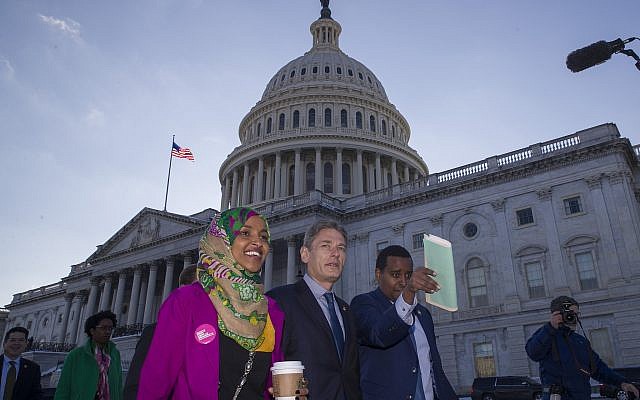 Rep. Ilhan Omar, D-Minn., left, Rep. Tom Malinowski, D-N.J., Rep. Joe Neguse, D-Colo., and other freshmen members of the House of Representatives walk to the Senate side to speak about the government shutdown on Capitol Hill, Tuesday, Jan. 15, 2019 in Washington. (AP Photo/Alex Brandon) Rep. Ilhan Omar, D-Minn., left, Rep. Tom Malinowski, D-N.J., Rep. Joe Neguse, D-Colo., and other freshmen members of the House of Representatives walk to the Senate side to speak about the government shutdown on Capitol Hill, Tuesday, Jan. 15, 2019 in Washington. (AP Photo/Alex Brandon)