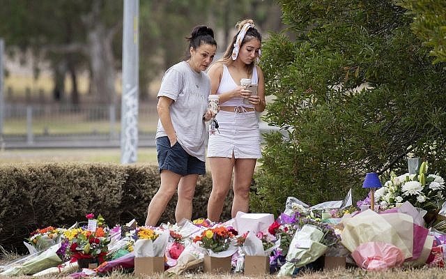 Two women stand at a floral tribute, Friday, Jan. 18, 2019, at the scene where the body of Israeli student Aiia Maasarwe was found earlier in the week in Melbourne, Australia.(Ellen Smith/AAP Image via AP) Two women stand at a floral tribute, Friday, Jan. 18, 2019, at the scene where the body of Israeli student Aiia Maasarwe was found earlier in the week in Melbourne, Australia.(Ellen Smith/AAP Image via AP)