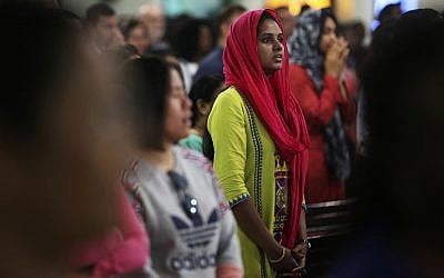 In this Sunday, Jan. 20, 2019 photo, parishioners pray during Mass at St. Mary's Catholic Church in Dubai, United Arab Emirates (AP Photo/Jon Gambrell)