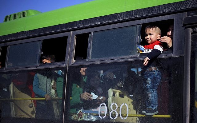 A refugee child looks out of a bus window that will take him home to Syria, in the northern Beirut suburb of Burj Hammoud, Lebanon, January 24, 2019. (AP Photo/Bilal Hussein) A refugee child looks out of a bus window that will take him home to Syria, in the northern Beirut suburb of Burj Hammoud, Lebanon, January 24, 2019. (AP Photo/Bilal Hussein)