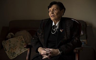 In this, Jan. 23, 2019 photo, Holocaust survivor Cipora Feivlovich speaks to The Associated Press at her house in Jerusalem  (AP Photo/Sebastian Scheiner)