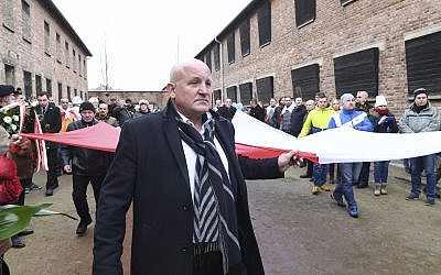 Polish far-right activists enter the former German Nazi death camp Auschwitz-Birkenau, on International Holocaust Remembrance Day, in Oswiecim, Poland, January 27, 2019. (AP Photo)