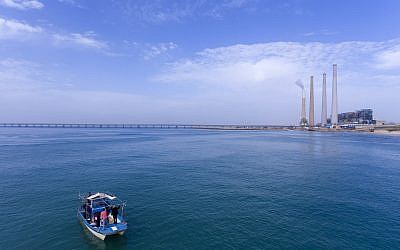 This January 21, 2019 photo, taken by a drone camera, shows researchers from the predator project at the Morris Kahn Marine Research Station established by the University of Haifa looking for sharks in the Mediterranean Sea off the coast of the northern Israeli city of Hadera.(AP Photo/Ariel Schalit)