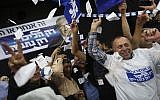 In this March 17, 2015 file photo, Prime Minister Benjamin Netanyahu's Likud party supporters react to exit poll results at the party's election headquarters In Tel Aviv. (AP Photo/Oded Balilty)