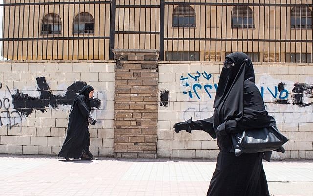 Illustrative. A female student walking past Al-Azhar university in Nasr City, Cairo, Egypt, June 9, 2015. (Mosa'ab Elshamy/AP) Illustrative. A female student walking past Al-Azhar university in Nasr City, Cairo, Egypt, June 9, 2015. (Mosa'ab Elshamy/AP)