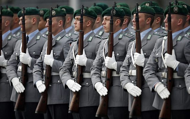 German soldiers stand guard for a military welcome ceremony of then-Defense Minister Thomas de Maiziere for his counterpart from Afghanistan, Bismillah Khan Mohammadi, at the defense ministry in Berlin, Germany on Oct. 24, 2013. (AP Photo/Michael Sohn) German soldiers stand guard for a military welcome ceremony of then-Defense Minister Thomas de Maiziere for his counterpart from Afghanistan, Bismillah Khan Mohammadi, at the defense ministry in Berlin, Germany on Oct. 24, 2013. (AP Photo/Michael Sohn)