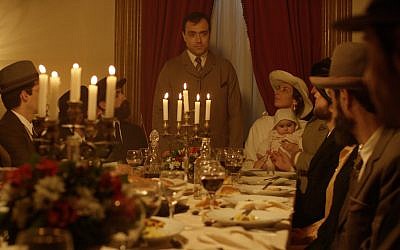 Portuguese army captain Arthur Carlos de Barros Basto (Rodrigo Santos) presides at the head of the table with his wife Lea and child in a scene from the new historical drama 'Sefarad.' (Courtesy Miami Jewish Film Festival)