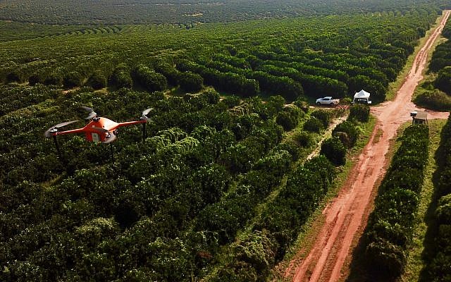 A SeeTree drone flying over fields (Courtesy)