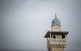 A man looks out from a minaret at the Al-Aqsa Mosque in the Old City of Jerusalem on January 23, 2018. (Yonatan Sindel/Flash90)