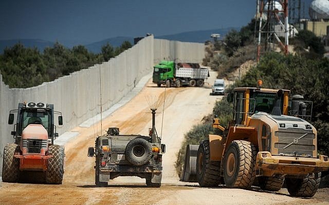 Construction work takes place near a new concrete wall on the border between Israel and Lebanon, near Rosh Hanikra in Northern Israel, on September 5, 2018. (Basel Awidat/Flash90) Construction work takes place near a new concrete wall on the border between Israel and Lebanon, near Rosh Hanikra in Northern Israel, on September 5, 2018. (Basel Awidat/Flash90)