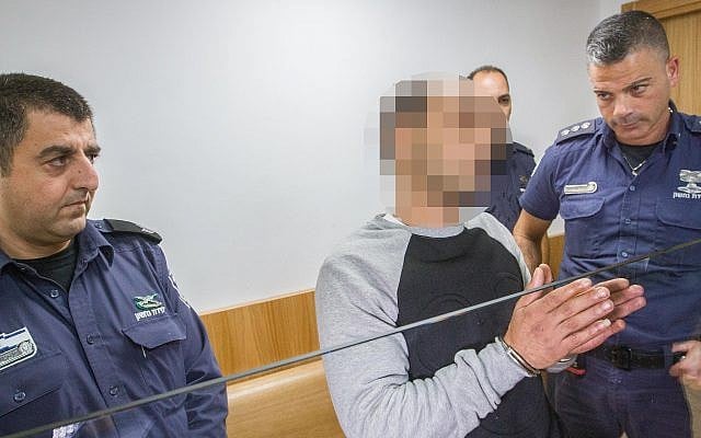 A man suspected of murdering his partner, Iman Awad in Acre, is brought to the Acre Magistrate's Court, on December 12, 2018. (Meir Vaknin/Flash90) A man suspected of murdering his partner, Iman Awad in Acre, is brought to the Acre Magistrate's Court, on December 12, 2018. (Meir Vaknin/Flash90)