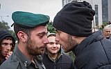 Right wing activists clash with police outside a court hearing in Rishon Lezion, on the matter of the Jewish youth suspects in a major security probe whose details are under gag order on December 31, 2018. (Flash90)