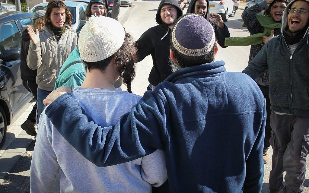 Suspects detained over their suspected involvement in the killing of a Palestinian woman are seen outside the Rishon Lezion Magistrate's Court after a judge releases them to house arrest, January 10, 2019. (Flash90) Suspects detained over their suspected involvement in the killing of a Palestinian woman are seen outside the Rishon Lezion Magistrate's Court after a judge releases them to house arrest, January 10, 2019. (Flash90)