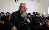 Matityahu Hirschman from “Kehillat Hamatmidim” arrives at Jerusalem District Court to hear the verdict in a case against him, on January 24, 2019. (Yonatan Sindel/Flash90)