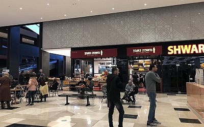 Drinking coffee at the new Atarot Mall, which will officially open on January 29, 2019 (Jessica Steinberg/Times of Israel)