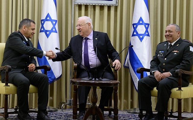 Lt. Gen. Aviv Kochavi, the incoming IDF chief of staff, left, President Reuven Rivlin, center, and Lt. Gen. Gadi Eisenkot, the outgoing IDF chief of staff at the President's Residence in Jerusalem to mark the changing of the guard in the IDF's top post, January 15, 2019. (Mark Neiman/GPO) Lt. Gen. Aviv Kochavi, the incoming IDF chief of staff, left, President Reuven Rivlin, center, and Lt. Gen. Gadi Eisenkot, the outgoing IDF chief of staff at the President's Residence in Jerusalem to mark the changing of the guard in the IDF's top post, January 15, 2019. (Mark Neiman/GPO)