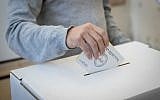Illustrative: A man casts his ballot at a voting station in Israel's municipal elections, October 30, 2018, in Jerusalem. (Yonatan Sindel/Flash90)