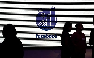 Media and guests mingle at a tour of Facebook's new 130,000-square-foot offices in Cambridge, Massachusetts, January 9, 2019. (AP Photo/Elise Amendola)