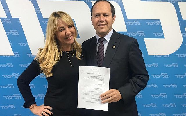 Nir Barkat (R) with an unidentified Likud official after signing his registration form for the Likud party primaries on January 14, 2019. (Courtesy) Nir Barkat (R) with an unidentified Likud official after signing his registration form for the Likud party primaries on January 14, 2019. (Courtesy)
