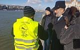 A ZAKA diver describes the search for remains of Holocaust survivors in the Danube River in Hungary to Interior Minister Aryeh Deri in January 2019. (Courtesy of ZAKA)