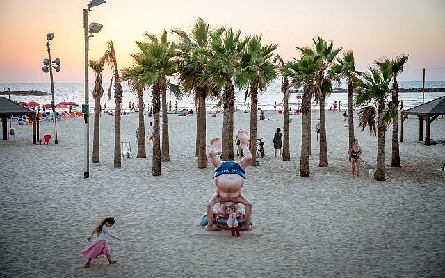 A statue of David Ben Gurion doing a headstand near his home on the beach in Tel Aviv. (Miriam Alster/Flash90)