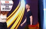 An anti-Israel protester holds a sign during a Eurovision qualifying contest in France on January 19, 2019. (screen capture: Pure Medias)