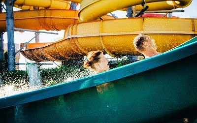 Illustrative. People enjoy a water slide. (Bortnikau, Getty Images)