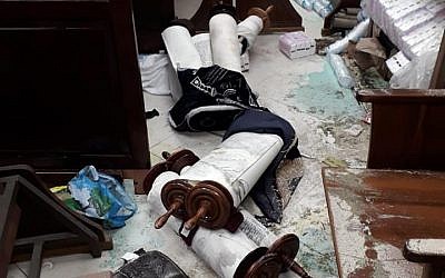 Torah scrolls thrown on the floor in Jerusalem synagogue attack, January 29, 2019 (Facebook)