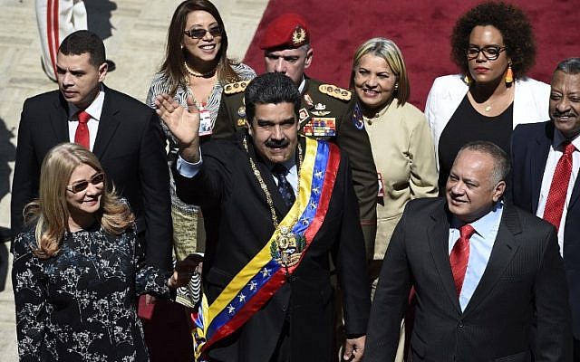 Venezuelan President Nicolas Maduro, center, his wife Cilia Flores, left, and the president of the Constituent Assembly Diosdado Cabello, right, arrive at the Federal Legislative Palace in Caracas on January 14, 2019. (Federico Parra/AFP) Venezuelan President Nicolas Maduro, center, his wife Cilia Flores, left, and the president of the Constituent Assembly Diosdado Cabello, right, arrive at the Federal Legislative Palace in Caracas on January 14, 2019. (Federico Parra/AFP)