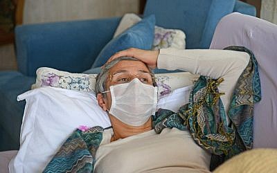 Pro-Kurdish Turkish MP Leyla Guven rests on a couch in her house in Diyarbakir, on January 30, 2019, as she continues her hunger strike. (Photo by ILYAS AKENGIN / AFP)