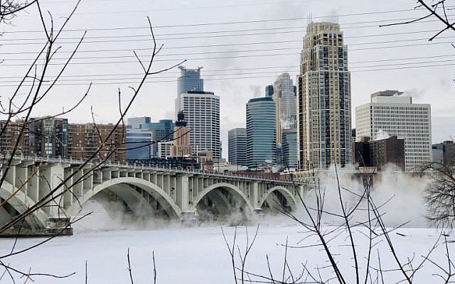 Water vapor rises above St. Anthony Falls on the Mississippi River beneath the Stone Arch Bridge during frigid temperatures on January 31, 2019 in Minneapolis, Minnesota. (Kerem Yucel / AFP) Water vapor rises above St. Anthony Falls on the Mississippi River beneath the Stone Arch Bridge during frigid temperatures on January 31, 2019 in Minneapolis, Minnesota. (Kerem Yucel / AFP)