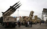 Iranians visit a weaponry and military equipment exhibition in the capital Tehran on Febraury 2, 2019, organized on the occasion of the 40th anniversary of the Iranian revolution. (Atta Kenare/AFP)