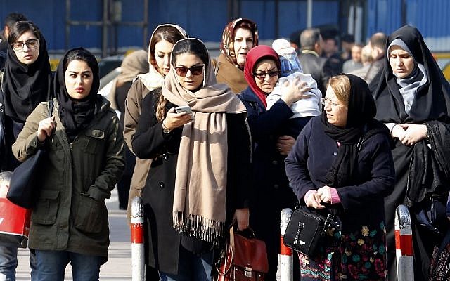 In this file photo taken on February 7, 2018, Iranian women wearing hijabs walk down a street in the capital Tehran. (Atta Kenare/AFP) In this file photo taken on February 7, 2018, Iranian women wearing hijabs walk down a street in the capital Tehran. (Atta Kenare/AFP)