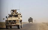This photo taken on January 31, 2019, shows US armored military vehicles patrolling in the countryside of Syria's eastern Deir Ezzor province. (Delil Souleiman/AFP)
