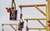 A picture shows a portrait of an Iranian opponent and flowers placed on a gallows, during a demonstration of the exiled Iranian opposition to protest against the Iranian government on February 8, 2019 in Paris. (Alain JOCARD / AFP)