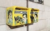 Antisemitic graffiti seen on letter boxes displaying a portrait of late French politician and Holocaust survivor Simone Veil, in the 13th arrondissement of Paris, February 11, 2019. (Jacques Demarthon/AFP)