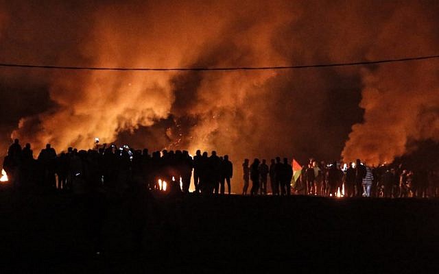 Palestinian rioters take part in a night demonstration near the fence along the border with Israel, east of Gaza City, on February 11, 2019. (Mahmud Hams/AFP) Palestinian rioters take part in a night demonstration near the fence along the border with Israel, east of Gaza City, on February 11, 2019. (Mahmud Hams/AFP)