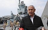 Illustrative: Prime Minister Benjamin Netanyahu speaks to journalists during a visit to inspect a naval Iron Dome defense system in the northern port of Haifa on February 12, 2019. (Jack Guez/Pool/AFP)