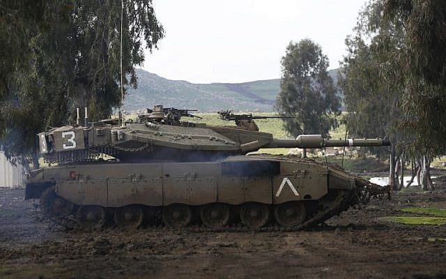 An Israeli army Merkava tank takes part in a military drill in the Israeli-annexed Golan Heights on February 12, 2019. (Photo by JALAA MAREY / AFP) An Israeli army Merkava tank takes part in a military drill in the Israeli-annexed Golan Heights on February 12, 2019. (Photo by JALAA MAREY / AFP)