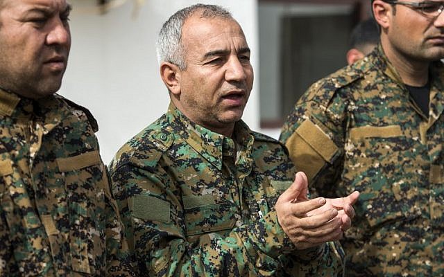 US-backed Syrian Democratic Forces commander Jia Furat (C) answers questions from reporters near the Omar oil field in the eastern Syrian Deir Ezzor province on February 16, 2019. (Fadel Senna/AFP) US-backed Syrian Democratic Forces commander Jia Furat (C) answers questions from reporters near the Omar oil field in the eastern Syrian Deir Ezzor province on February 16, 2019. (Fadel Senna/AFP)