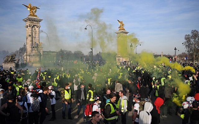 Demonstrators in Paris on February 16, 2019, marking three months of "yellow vest" protests against government policies. (ERIC FEFERBERG / AFP) Demonstrators in Paris on February 16, 2019, marking three months of "yellow vest" protests against government policies. (ERIC FEFERBERG / AFP)