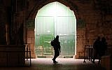An Israeli border police officer patrols an entrance to the Temple Mount in Jerusalem's Old City, on February 19, 2019.  (Ahmad Gharabli/AFP)