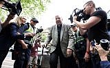 Cardinal George Pell (C) walks from a car in Melbourne on February 26, 2019. (Asanka Brendon Ratnayake / AFP)