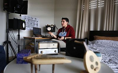 Sarouna, a Palestinian DJ, works on a music track at her home in Ramallah, February 7, 2019. (ABBAS MOMANI / AFP)
