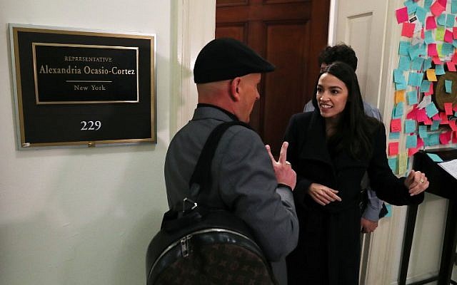 Rep. Alexandria Ocasio-Cortez (D-NY) speaks to a supporter outside of her office in the Cannon House Office Building on Capitol Hill February 14, 2019 in Washington, DC. (Mark Wilson/Getty Images/AFP) Rep. Alexandria Ocasio-Cortez (D-NY) speaks to a supporter outside of her office in the Cannon House Office Building on Capitol Hill February 14, 2019 in Washington, DC. (Mark Wilson/Getty Images/AFP)